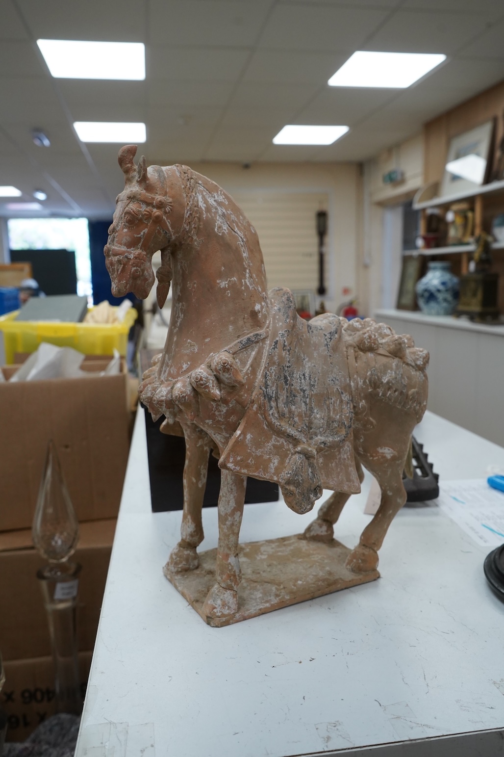 A Chinese pottery figure of a horse, Tang dynasty or later, 40cm high